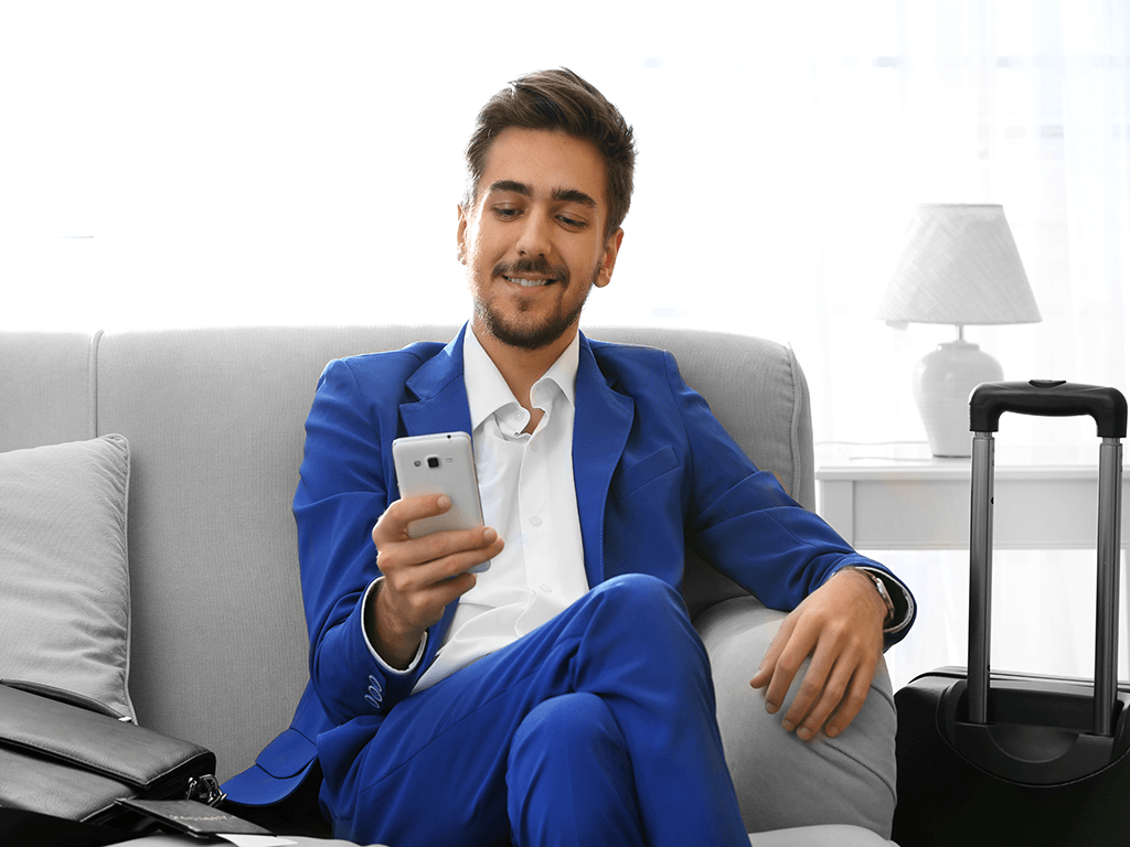 man-in-blue-suit-with-cellphone